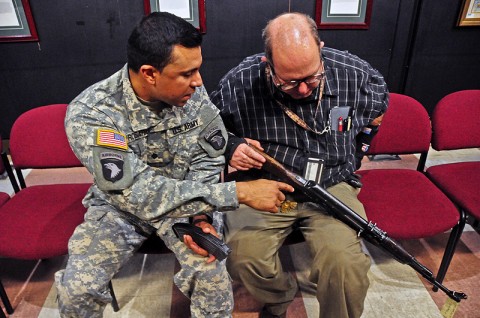 Jose Rosario, a deploying Strike Soldier from one of the Security Force Assistance Teams with the 2nd Brigade Combat Team, 101st Airborne Division (Air Assault), asks John E. Foley, the foreign weapons instructor at Fort Campbell’s Don F. Pratt Museum, a question about the Ak-47 series weapon during a foreign weapons training exercise held at the museum, Feb. 27th. The Strike Soldiers were trained on foreign weapons commonly seen in Afghanistan. (U.S. Army photo by Sgt. Joe Padula, 2nd BCT PAO, 101st Abn. Div.) Jose Rosario, a deploying Strike Soldier from one of the Security Force Assistance Teams with the 2nd Brigade Combat Team, 101st Airborne Division (Air Assault), asks John E. Foley, the foreign weapons instructor at Fort Campbell’s Don F. Pratt Museum, a question about the Ak-47 series weapon during a foreign weapons training exercise held at the museum, Feb. 27th. The Strike Soldiers were trained on foreign weapons commonly seen in Afghanistan. (U.S. Army photo by Sgt. Joe Padula, 2nd BCT PAO, 101st Abn. Div.)