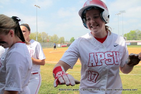 Amy Mills hit a single that drove in Morgan Brewer. Brewer gives high fives as she enters the dug out after scoring. Austin Peay Women's Softball.