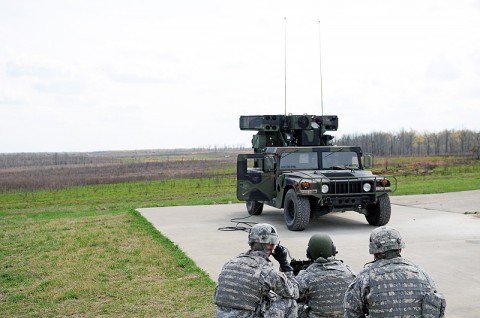 Soldiers with C Battery, 2nd Battalion, 44th Air Defense Artillery Regiment, 101st Sustainment Brigade, look in at the remote forward-looking infrared receiver, which fires the M3P machine gun away from the truck. The Avenger batteries of the 2-44 Battalion went to the range this week to certify on their weapons by shooting ground and aerial targets from the turret and remotely. (Photo by Spc. Michael Vanpool)