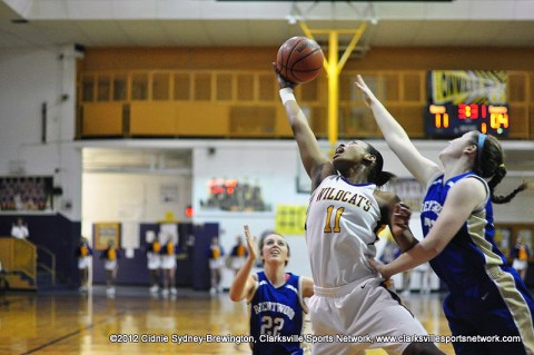 Bashaara Graves (11) grabs a rebound with one had in Clarksville High's 55-34 victory in a Sectional game on March 3, 2012, and advances to the Class AAA State Tournament with the victory.