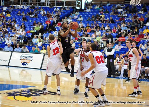 EJ Holmes sails over the Cherokees in the lane in Thursday's first round of play. Clarksville High wins 53-47 over Cherokee and will go on to play in Friday's Semifinal game.