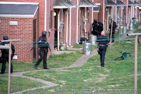 Clarksville Tactical Unit moves into position around an apartment on Ladd Street.