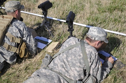 Spc. Wesley R. Ambrosini, and Spc. Alec S. Daniel, snipers with 2nd Battalion, 327th Infantry, 1st Brigade Combat Team, 101st Airborne Division, mark their range cards during their sniper training, March 13, at the range here. (Photo by Sgt. Jon Heinrich)