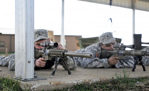  Sgt. Curtis D. Clausing, a reconnaissance squad leader, and Spc. Jimmy Chavez, a sniper, both with Headquarters and Headquarters Company, 1st Battalion, 327th Infantry, 1st Brigade Combat Team, 101st Airborne Division, stare through the scopes of their M110 Semi-Automatic Sniper System rifles, March 12th, at the range here. The two snipers were checking the adjustments they made to their rifles as part of their sniper training. (Photo by Sgt. Jon Heinrich)