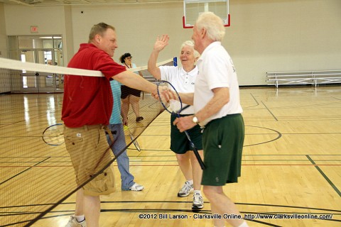 Clarksville Department of Parks and Recreation Director Mark Tummons congratulates members of the Clarksville Badminton Club on their victory