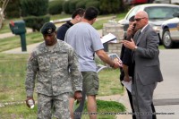 Clarksville Police Officers review soldier's photos to try to identify the shooter