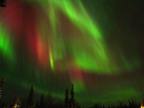 Auroras occur primarily near Earth's poles. They are the most common and the only visual result of space weather. This aurora image associated with solar flares and CMEs on February 23drd-24th, 2012 was taken over Muonio, Finland before sunrise on February 27th, 2012. (Image Courtesy of Thomas Kast.)