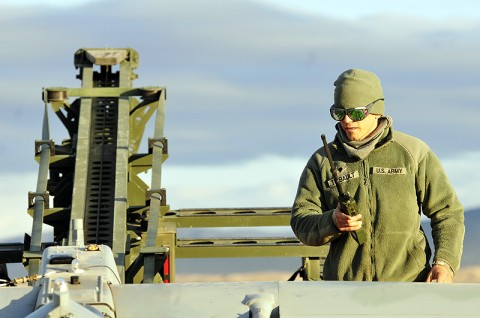 Spc. David Thibault, F Troop, 2nd Squadron, 17th Cavalry Regiment, 101st Combat Aviation Brigade, unmanned aerial system maintainer, communicates with the UAS operator while conducting pre-flight operations, Feb. 17th, 2012, at the National Training Center, Fort Irwin, CA. (Photo by Sgt. Tracy Weeden)