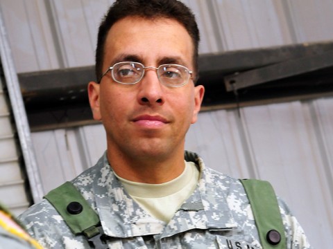 Capt. Anselmo Brillon, chaplain, listens as a member of Task Force Saber, 101st Aviation Brigade, 101st Airborne Division, talks to him at the Forward Operating Base Miami chapel during TF Saber's February rotation to the National Training Center at Fort Irwin, CA. (Photo by Sgt. Duncan Brennan)