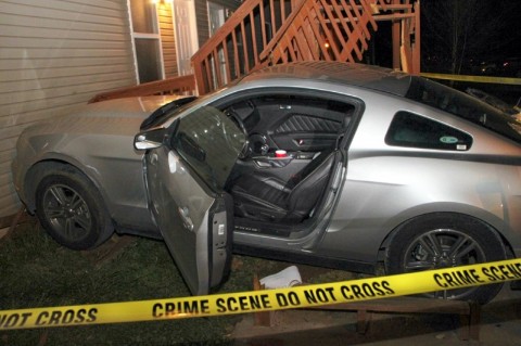 Mustang crashed hehind an apartment building after man was shot. (Photo by CPD- Jim Knoll)