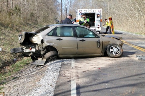 Clarksville Police look over the 2002 Ford Focus that crashed on Needmore Road sending four teenagers to the hospital. (Photo by CPD-Jim Knoll)