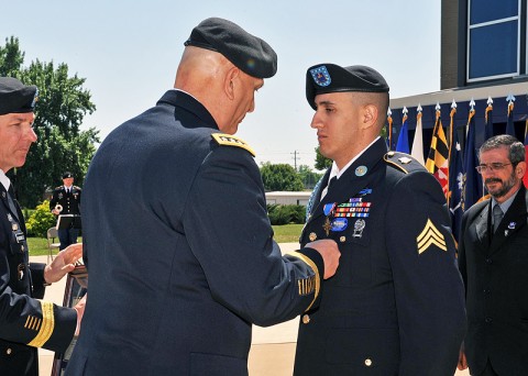 U.S. Army Gen. Ray Odierno, the Chief of Staff of the Army, presents the Distinguished Service Cross (DSC) to Sgt. Felipe Pereira an infantryman from the 2nd Brigade Combat Team "Strike", 101st Airborne Division (Air Assault) at McAuliffe Hall, Fort Campbell, KY on April 12th, 2012. (U.S. Army Photo by Sam Shore/Released.)