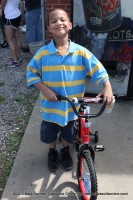 Malachi Miller standing next to his new bike.