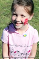 Sydney Hamilton got a rose painted on her cheek.