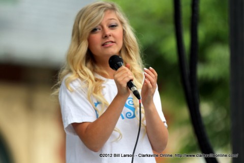 A performer from Gateway Cast and Crowns performing on the Courthouse Stage on Saturday morning