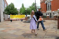 Autumn Hassell the Parade Bell Ringer followed by The Children’s Parade Banner carried by members of the Citizen’s Police Academy.