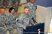 Col. Michael Peterman, the Commander of the 101st Sustainment Brigade addresses the returning soldiers