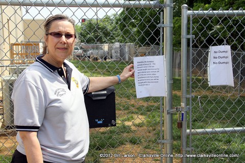 Montgomery County Animal Control Director Karen Josephson points out the no dumping signs