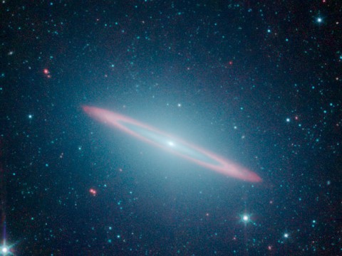 The infrared vision of NASA's Spitzer Space Telescope has revealed that the Sombrero galaxy -- named after its appearance in visible light to a wide-brimmed hat -- is in fact two galaxies in one. (Image credit: NASA/JPL-Caltech)