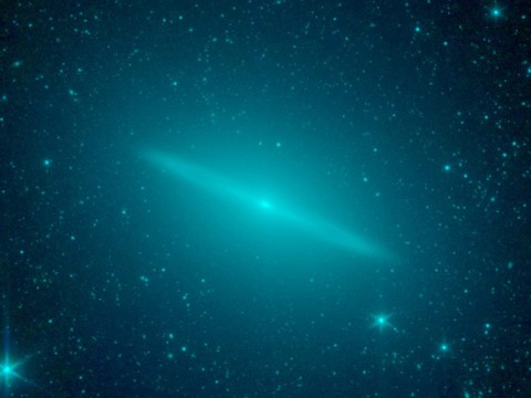 New observations from NASA's Spitzer Space Telescope reveal the Sombrero galaxy is not simply a regular flat disk galaxy of stars as previously believed, but a more round elliptical galaxy with a flat disk tucked inside. (Image credit: NASA/JPL-Caltech)