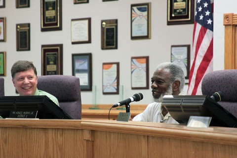 Schools Director Mike Harris (l) and Vice Chair Horace Murphy, Jr.(r) thank teachers, staff and administrators for their hard work.