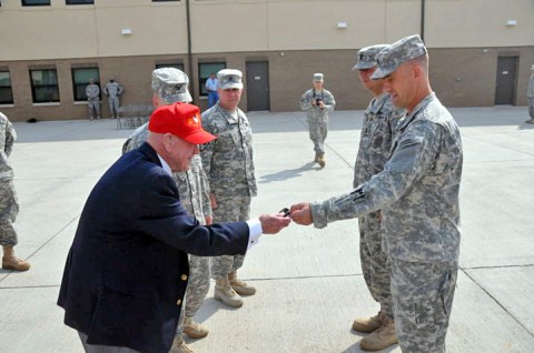 John Fallon, a former captain with the 36th Engineer Brigade, gives a “Seahorse” patch to a Soldier from the 326th Engineer Battalion, 101st Sustainment Brigade, during a Patch ceremony at Fort Campbell. The “Sapper Eagles” are attached to the Lifeliners while assigned to Fort Campbell. (U.S. Army photo by Sgt. 1st Class Pete Mayes.)