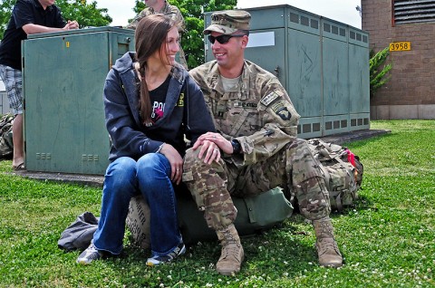 Capt. James Carrier, an advisory team commander from Company D, 1st Battalion, 502nd Infantry Regiment, 2nd Brigade Combat Team, 101st Airborne Division (Air Assault), spends time with his wife Erin before departing Fort Campbell for eastern Afghanistan, Apr 27th. Carrier is part of the deploying Strike Soldiers heading the new Afghan mission in transitioning power to the Afghan National Security Forces. (U.S. Army photo by Sgt. Joe Padula, 2nd BCT PAO, 101st Abn. Div.)