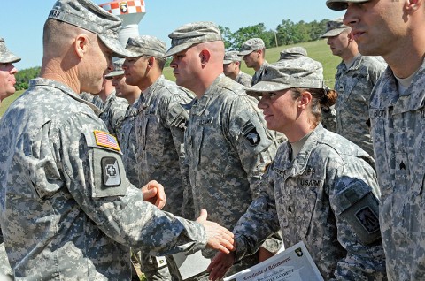 Col. Steven Drennan, commander of the 86th Combat Support Hospital, awards an Expert Field Medical Badge to Sgt. Rachel Barrett, a health care specialist with the 2nd Battalion, 44th Air Defense Artillery Regiment and a native of Murfreesboro, TN, May 11th, 2012 at Fort Campbell, KY. (U.S. Army photo by 101st Sustainment Brigade Public Affairs.) Col. Steven Drennan, commander of the 86th Combat Support Hospital, awards an Expert Field Medical Badge to Sgt. Rachel Barrett, a health care specialist with the 2nd Battalion, 44th Air Defense Artillery Regiment and a native of Murfreesboro, TN, May 11th, 2012 at Fort Campbell, KY. (U.S. Army photo by 101st Sustainment Brigade Public Affairs.)