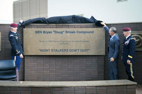 From Left to Right: Col. John Thompson, regiment commander, 160th Special Operations Aviation Regiment (Airborne), retired Gen. Bryan “Doug” Brown, and Maj. Gen. Kevin W. Mangum, commanding general, United States Army Special Operations Aviation Command unveil the new sign greeting visitors to the home of the 160th SOAR (A). (160th Special Operation Aviation Regiment photo)