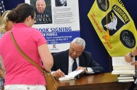 Jennifer Krog watches as Colin Powell signs a copy of his new book, “It Worked for Me: In Life and Leadership,” at Fort Campbell’s Post Exchange Wednesday afternoon. Powell, who once served as 2nd Brigade commander for the 101st Airborne Division in 1976, revisited the installation on the Kentucky-Tennessee state line as a part of his book tour. (U.S. Army photo by Megan Locke Simpson, Fort Campbell Courier)