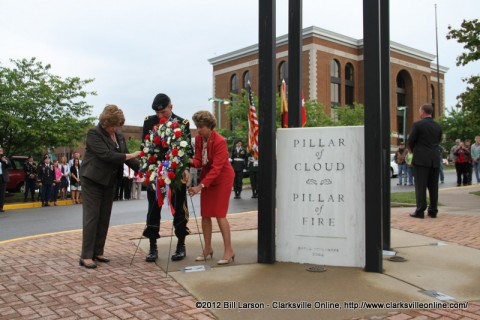 Montgomery County Mayor Carolyn Bowers, Maj. Gen. James C. McConville, and Clarksville Mayor Kim McMillan lay the wreath at the Eternal Flame on Public Square