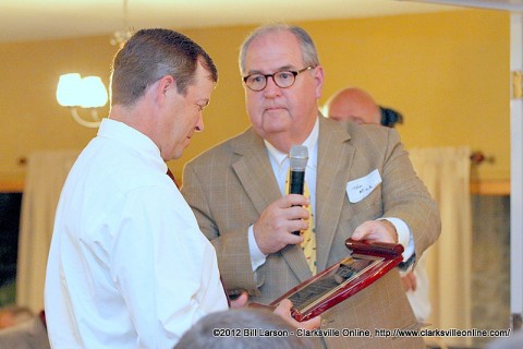 Scott Beasley being presented with the Hugh Akerman Alumni of the Year Award  by Alumni Association President Tom Mink