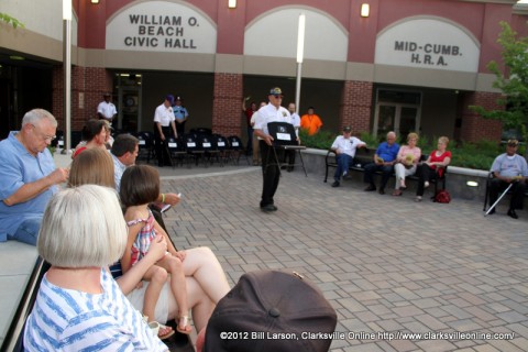 A Vietnam Veterans of American member carries forward the chair of one of the POW/MIA soldiers at the 2012 Candle Light Vigil