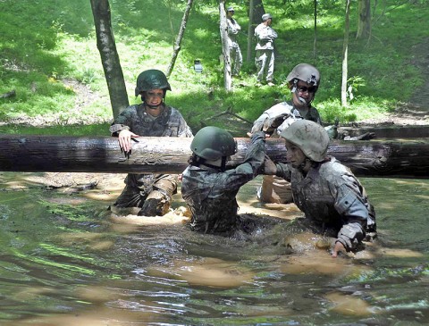 Lady Night Stalkers from 2nd Battalion, 160th Special Operations Aviation Regiment (Airborne) navigate through the water pit in the obstacle course during the Pink Platoon event May 9th at Fort Campbell, KY. (160th Special Operation Aviation Regiment (Airborne)  photo)