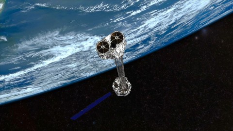 Artist's concept showing NASA's NuSTAR mission orbiting Earth. NuSTAR will hunt for hidden black holes and other exotic cosmic objects. (Image credit: NASA/JPL-Caltech)