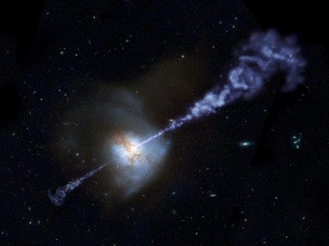 This artistically modified image of the local galaxy Arp 220, captured by the Hubble Space Telescope, helps illustrate the Herschel results. The bright core of the galaxy, paired with an overlaid artist's impression of jets emanating from it, indicate that the central black hole's activity is intensifying. As the active black hole continues to rev up, the rate of star formation will, in turn, be tamped down in the galaxy. (Image credit: NASA/JPL-Caltech)
