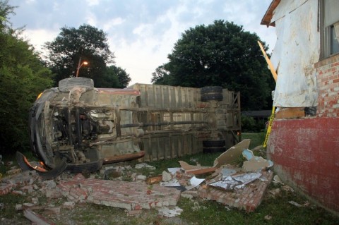 Stolen building supply truck crashes into the side of a house. (Photo by CPD-Jim Knoll)