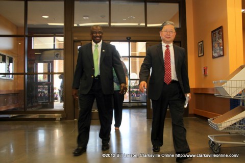 Store Director Tony Matthias and DeCA Director and CEO Joseph H. Jeu Leading the crowd into the new commissary