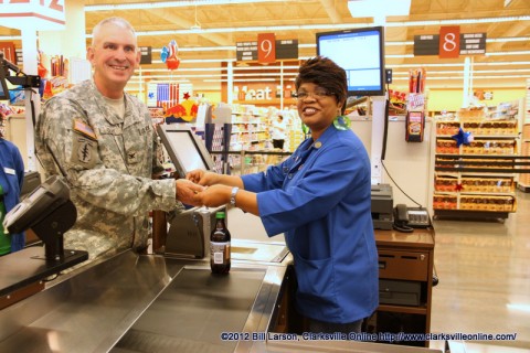 Col. Perry Clark making the first purchase at the New Commissary