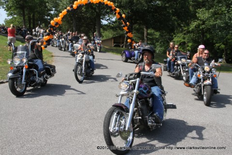 Members of the Bikers Who Care stream into Camp Rainbow to visit with the kids on June 14th 2012 Members of the Bikers Who Care stream into Camp Rainbow to visit with the kids on June 14th 2012