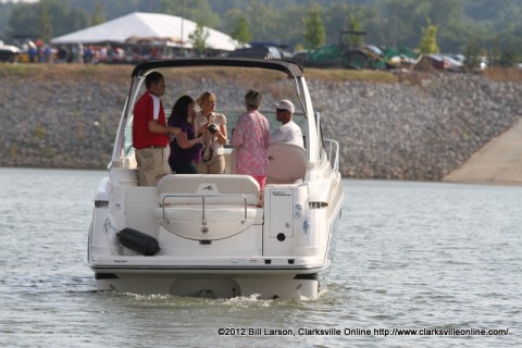 One of the boats from Bill Roberts Thunder Road Automotive and Marine brings Chamber members back in to the docks at Business After Hours on Thursday