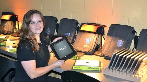 Cara Miller, Director of Technology at Clarksville Academy prepares the iPad3s for launch.