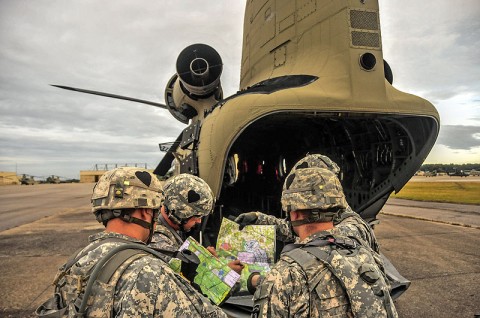 Soldiers and Leaders from the Strike Brigade staff, 2nd Brigade Combat Team, 101st Airborne Division (Air Assault), create a plan of attack prior to an air assault mission during an operation Talon Shock, July 12th held at Fort Campbell, KY. (U.S. Army photo by Sgt. Joe Padula, 2nd BCT PAO, 101st Abn. Div.)