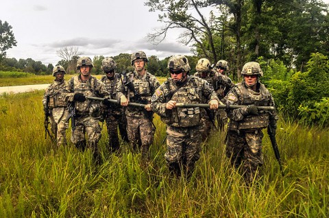 Soldiers and Leaders from Headquarters and Headquarters Company, 1st Battalion, 502nd Infantry Regiment, 2nd Brigade Combat Team, 101st Airborne Division (Air Assault) and the brigade staff drags a 300-pound crate during a weekly training exercise called Talon Shock, July 12th held at Fort Campbell, KY. The crate is part of a found enemy weapon cache and was dragged half a mile to an extraction point. (U.S. Army photo by Sgt. Joe Padula, 2nd BCT PAO, 101st Abn. Div.)