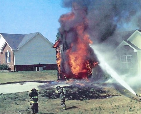 Clarksville Fire Rescue firefighters putting out an arson fire at 3650 Oakland Road.