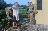 A 3rd Special Troops Battalion, 3rd Brigade Combat Team Soldier (left) searches a Soldier who is role playing an insurgent (middle) for weapons prior to detaining him during an air assault training exercise at Fort Campbell Ky., Aug. 8. The air assault training exercise is a part of 3rd STBs pre-deployment schedule.(U.S. Army photo by Sgt. Shanika L. Futrell, 159th Combat Aviation Brigade Public Affairs)