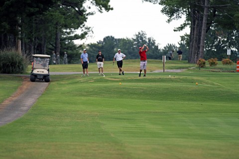 Chief Warrant Officer 2 Eric Ward, an ammunition officer for the 2nd Brigade Combat Team, 101st Airborne Division (Air Assault), follows through with his chip off of the 17th tee box where he won the closest to the pin competition with a hole-in-one during the Week of the Eagles Legacy Golf tournament held at Fort Campbell’s Cole Park Commons, Aug. 13. Ward said about making the shot, “That’s my first hole-in-one” (U.S. Army photo by Sgt. Jason Ross, 2nd BCT PAO, 101st Abn. Div.)