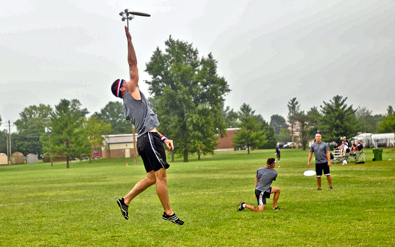 A soldier from team “Lat Attack” 2nd Brigade Combat Team 101st Airborne Division (Air Assault) gets some air going for the Frisbee, Tuesday August 14, during the 2012 “Week of the Eagles.” This is the first time Ultimate Frisbee has been played. (U.S. Army photo by Spc. Bart Wigal, 2nd BCT PAO, 101st ABN. Div.)