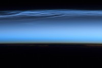 Astronauts on board the ISS took this picture of noctilucent clouds near the top of Earth’s atmosphere on July 13th, 2012. (Credit: NASA)