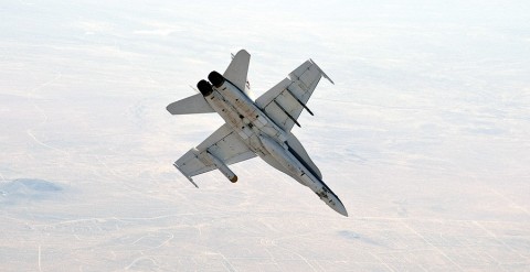 NASA Dryden's F/A-18 No. 852 rolls into a 40-degree dive during verification and validation flight tests of the Mars Science Laboratory's landing radar housed in a pod under its left wing. (NASA / Carla Thomas)